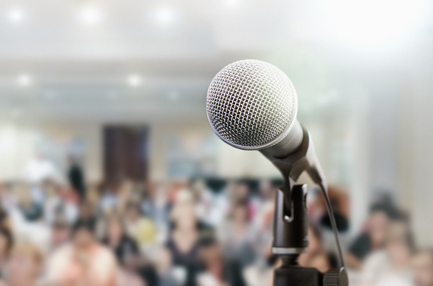 Microphone awaits public speaker at seminar